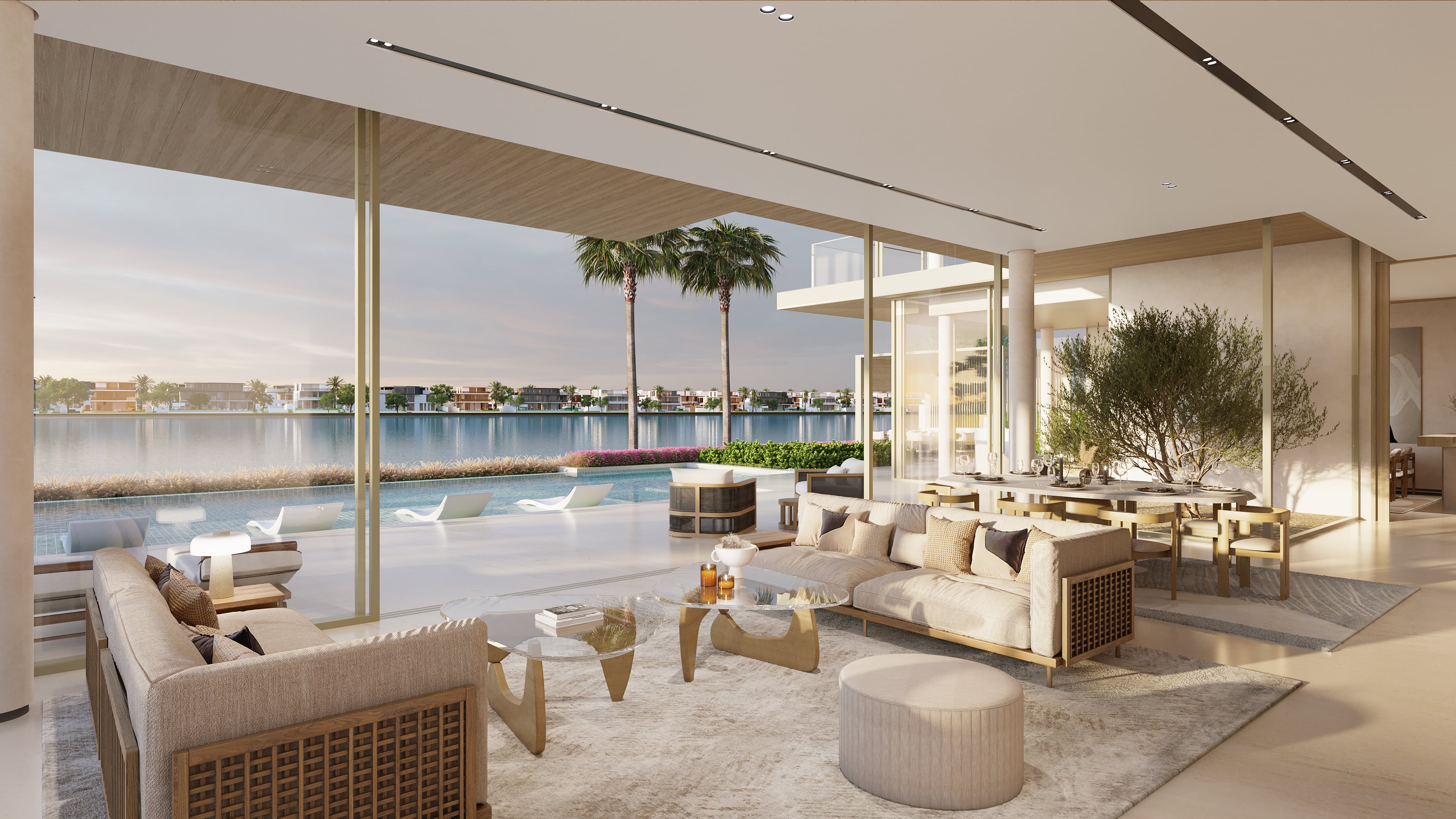 A luxurious living space featuring a designer table and chairs, bathed in warm light from a chandelier, with a breathtaking vista of a lake.
